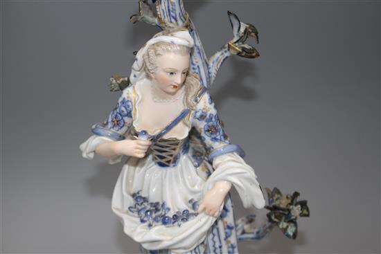 A pair of Meissen porcelain candelabra, modelled with lady and gallant stems, height 46cm